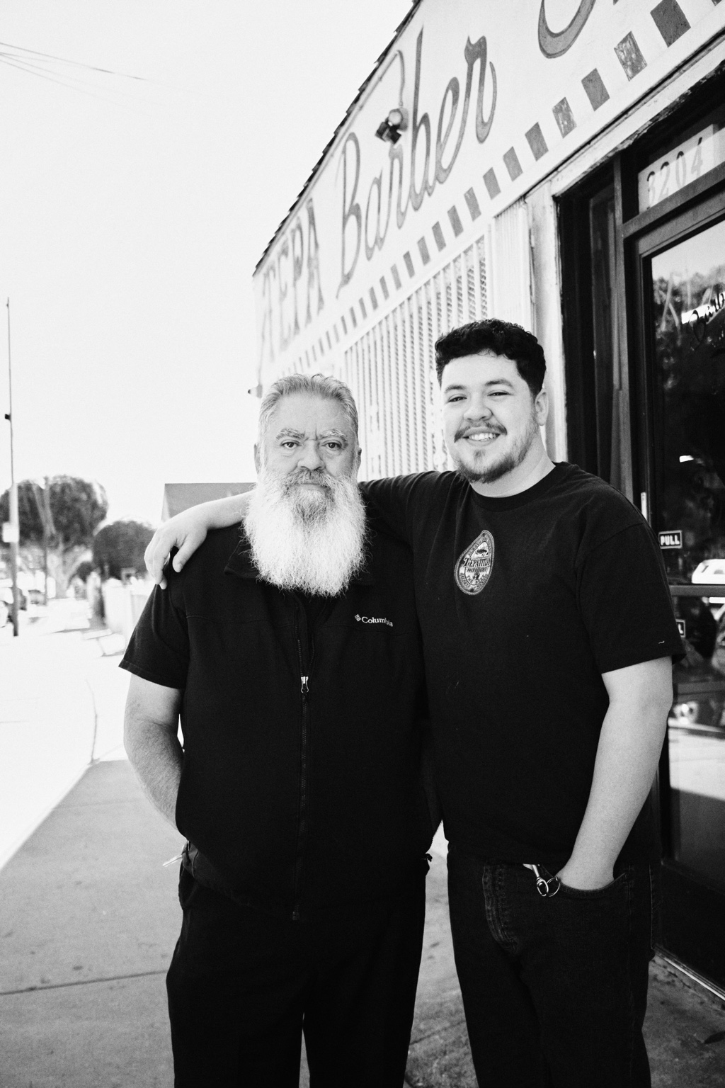 Ricardo with his father outside Tepa Barbershop