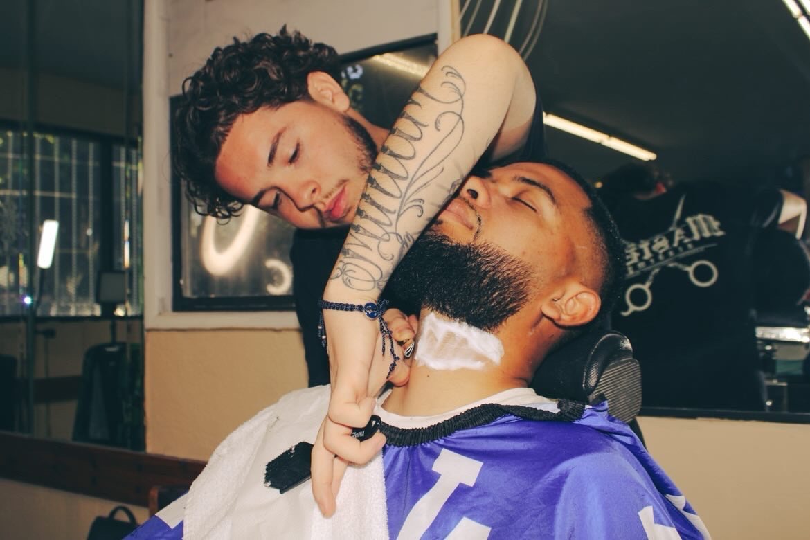 Traditional shave service being performed at Tepa Barbershop
